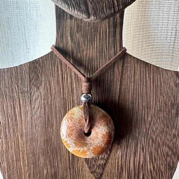 Light Yellow Coral Fossil Donut Pendant Necklace on Brown Faux Suede - Picture 7 of 11